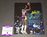 Magic Johnson autographed 8x10 Beckett Witness COA